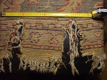 alfombra turca rota antes de restauración